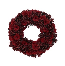 These 15 inch wreaths hang from black satin ribbon in every window. The deep deep red being the star of our show this year.